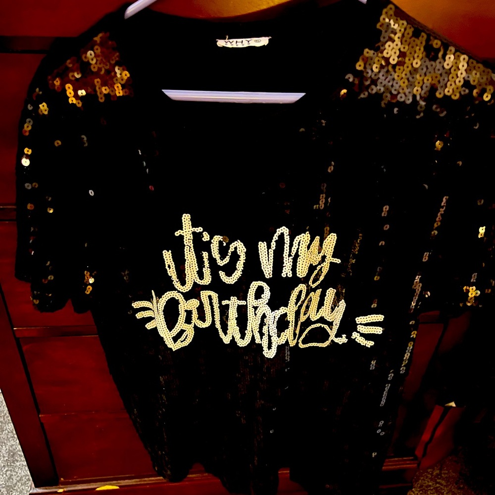 Black and white sequins top. That say it’s my birthday.